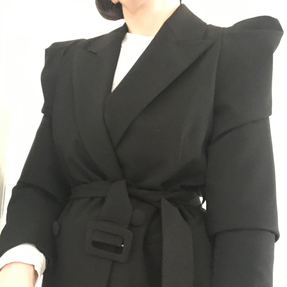 Black cross blazer with shoulder detail.